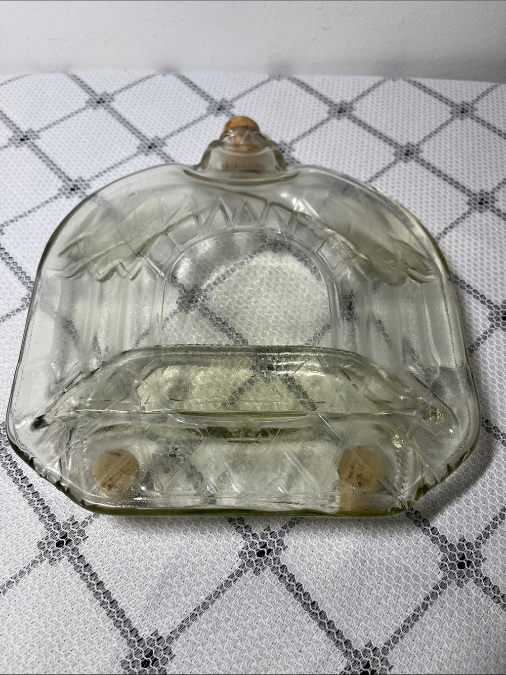 Tray or mat created by heating a glass bottle until it flattens
Unique